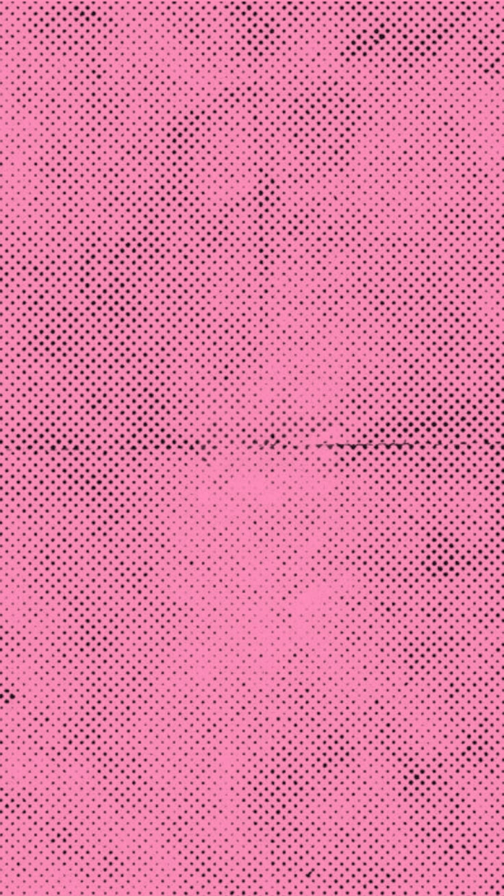 a pink background with black dots