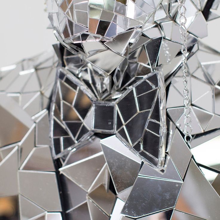 an animal made out of mirrors and chains