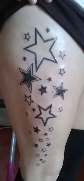 a woman's thigh with stars on it