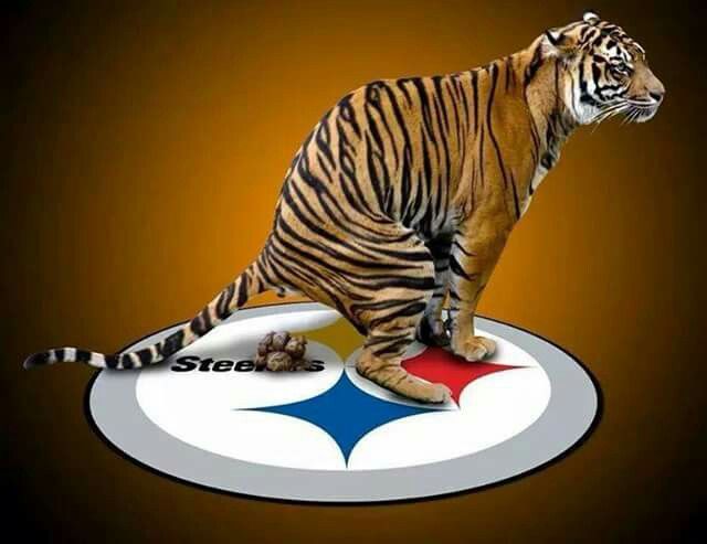 a tiger standing on top of a football logo