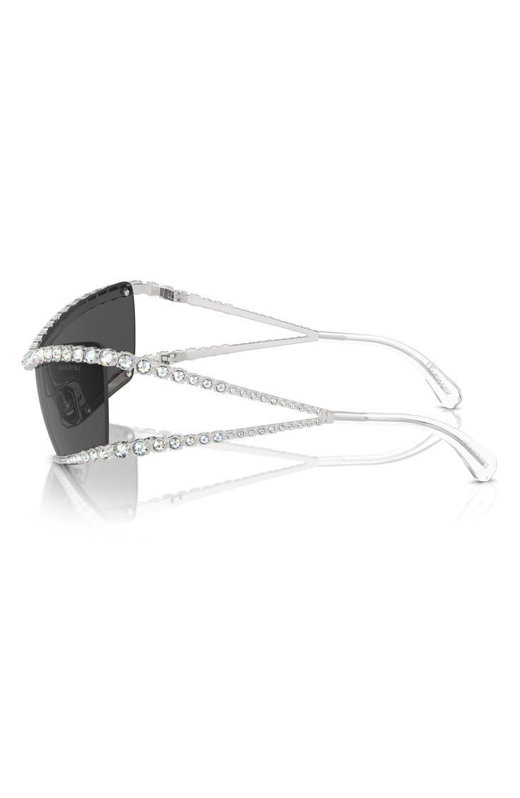 Sparkling crystals enrich the frames of statement-making sunnies fitted with adjustable nose pads for a secure fit. 40mm lens width; 187mm bridge width; 125mm temple length 100% UV protection Adjustable nonslip nose pads Metal/crystal Imported Silver Rimless Sunglasses For Evening, Silver Rimless Evening Sunglasses, Luxury Rimless Sunglasses For Party, Evening Clear Sunglasses With Mirrored Lenses, Luxury Rimless Party Sunglasses, Elegant Shield Sunglasses With Uv Protection, Elegant Glass Shield Sunglasses With Uv Protection, Elegant Rimless Shield Sunglasses With Gradient Lenses, Elegant Rimless Shield Sunglasses With Mirrored Lenses