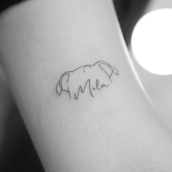 a small elephant tattoo on the left inner arm, with the word mama written in cursive font