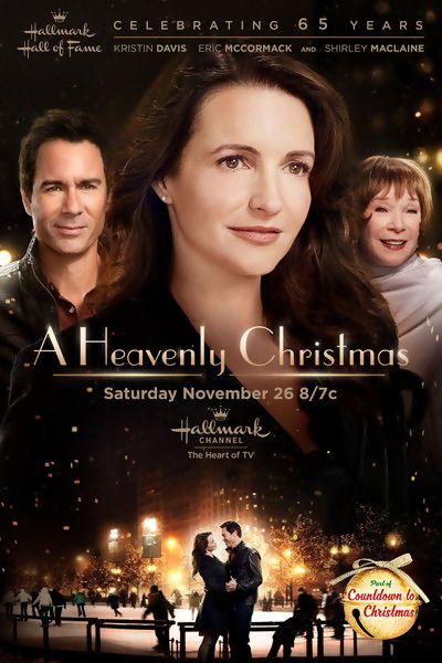 a heavenly christmas poster with two people