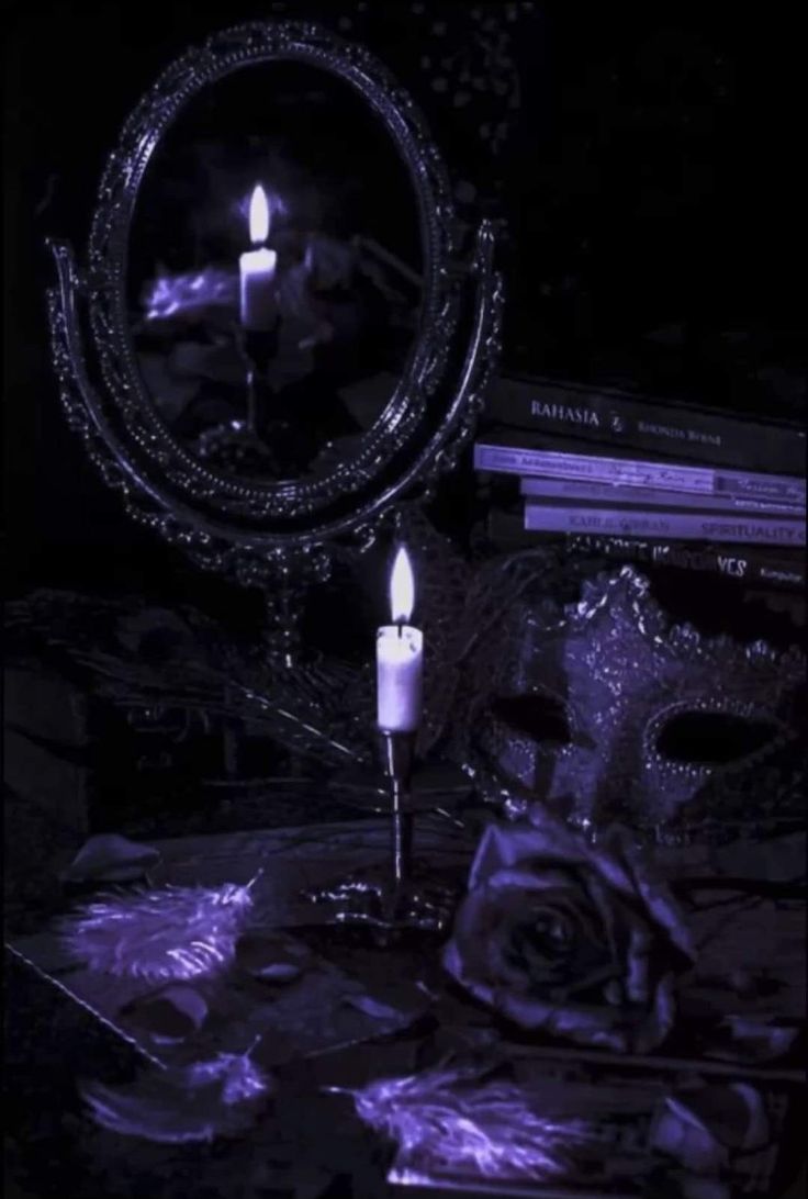 a candle that is sitting in front of a mirror