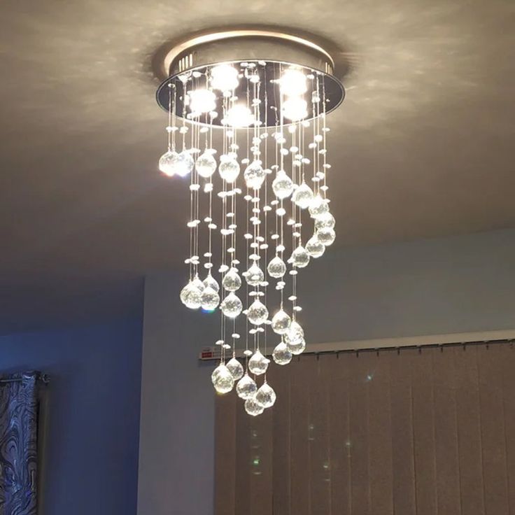 a chandelier hanging from the ceiling in a room