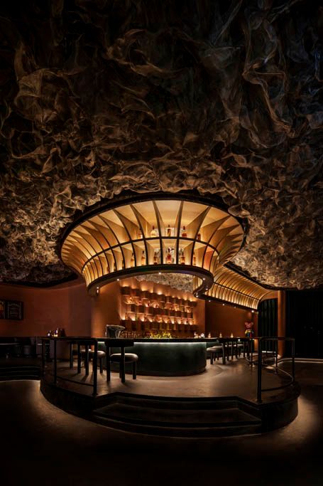 the interior of a restaurant lit up at night