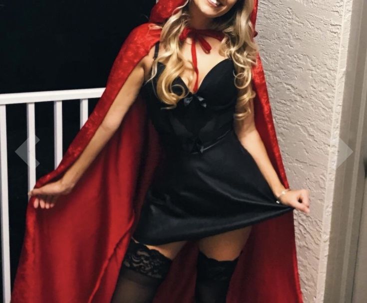 a woman dressed as a vampire posing for the camera