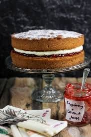 there is a cake and jam on the table