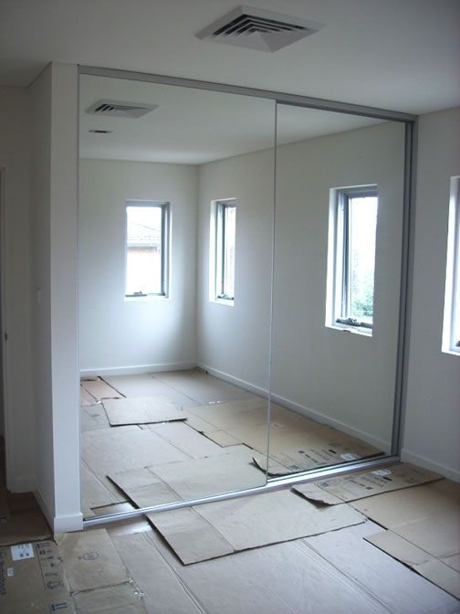 an empty room that is being remodeled with new windows and flooring on the ground