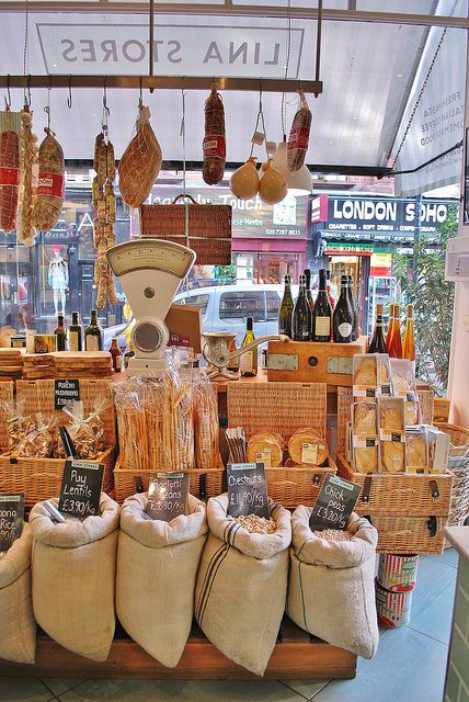 a display in a store filled with lots of different types of breads and wine