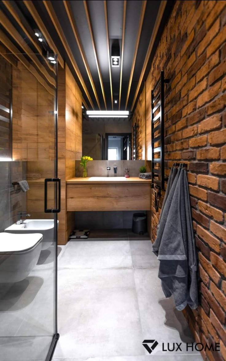 a modern bathroom with wooden walls and flooring