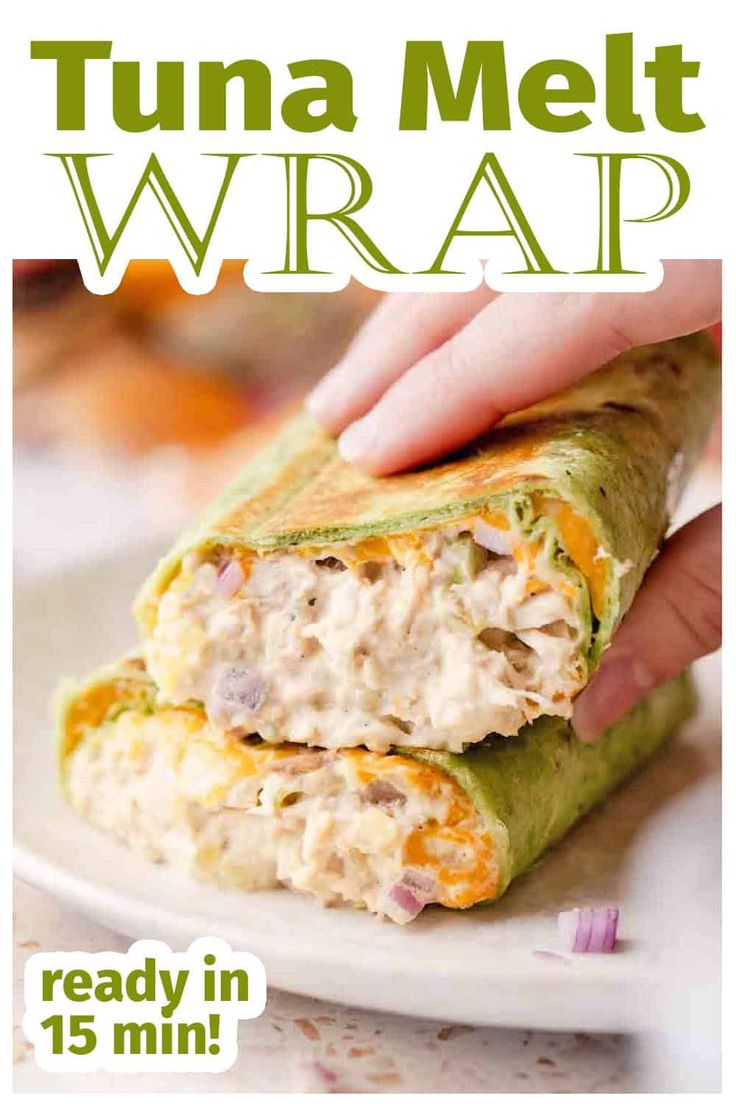 a hand is holding a sandwich wrap on a plate with the words, tuna melt wrap ready in 15 minutes