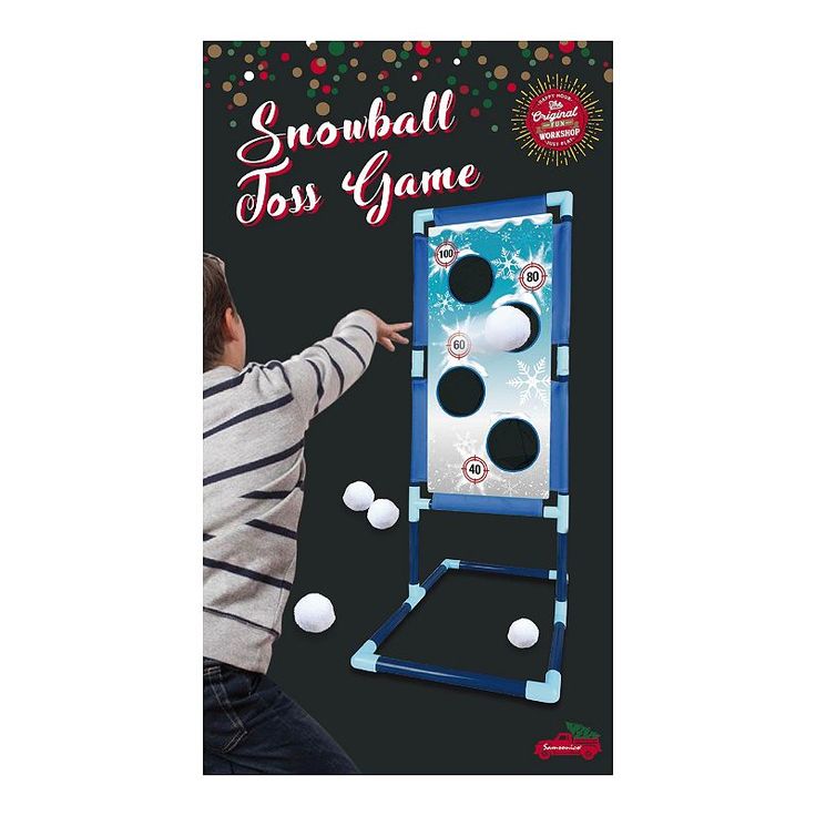 a young boy is playing with the snowball toss game in front of a black background