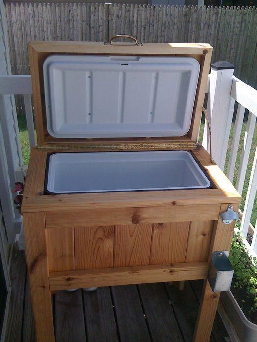 an ice chest sitting on top of a wooden deck