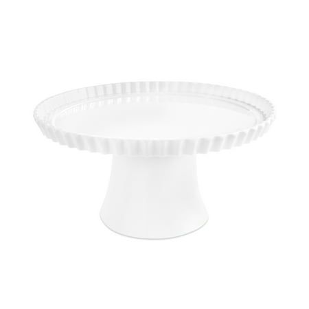 a white cake plate sitting on top of a table