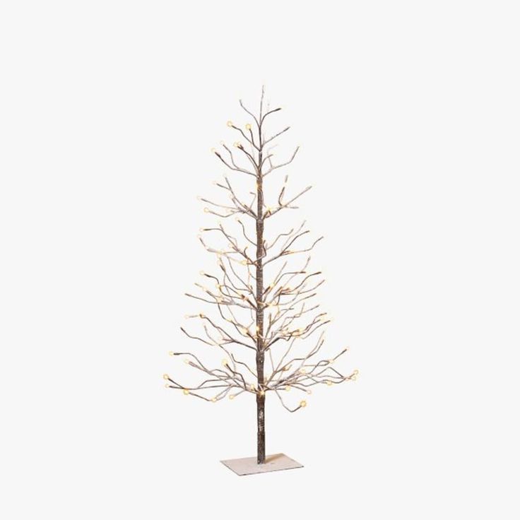 a small white christmas tree with lights on it's branches and no leaves in front of a white background