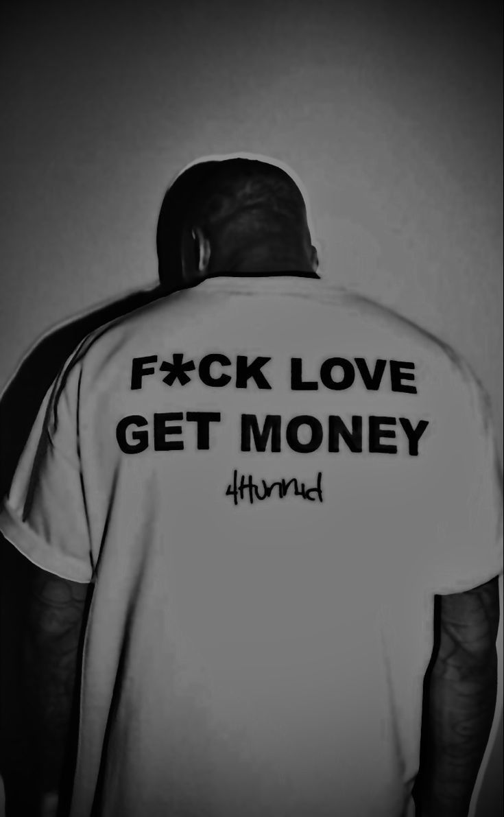 the back of a man's shirt that says f xck love get money