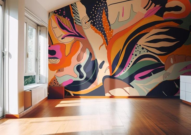 an empty room with a large mural on the wall