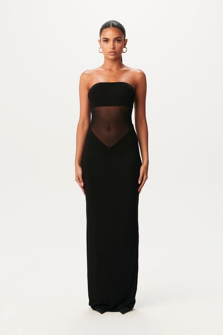 This sexy maxi dress is designed with a bandeau-like tube neckline, a sheer mesh contrast at the core, and v-waist to create and give shape. Smooth Collection Import Self + Lining: 92% Viscose Rayon, 8% Spandex Contrast: 95% Polyester, 5% Spandex True to size Double-lined Mesh Wrap Dress, One Shoulder Mesh Dress, Open Back Maxi Dress Formal, Classy Tube Dress, Black Crochet Maxi Dress, Cruise Black Tie Dress, Black Sheer Maxi Dress, Sheer Cocktail Dress, Cool Wedding Guest