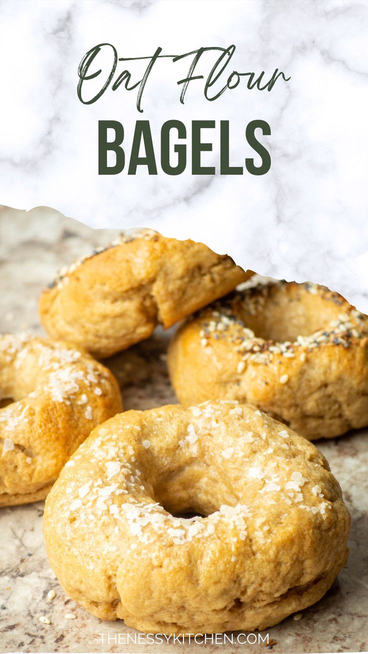 bagels with powdered sugar and sprinkles on them are sitting on a marble surface