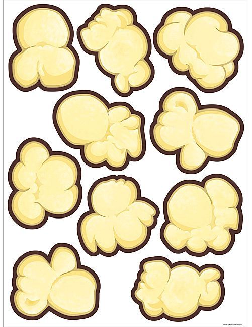 a bunch of yellow popcorn kernels on a white background