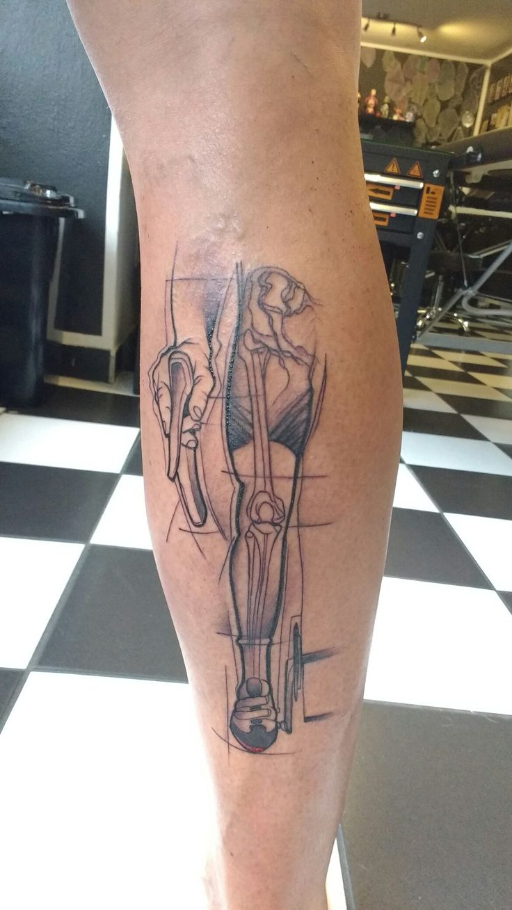 a person with a tattoo on their leg