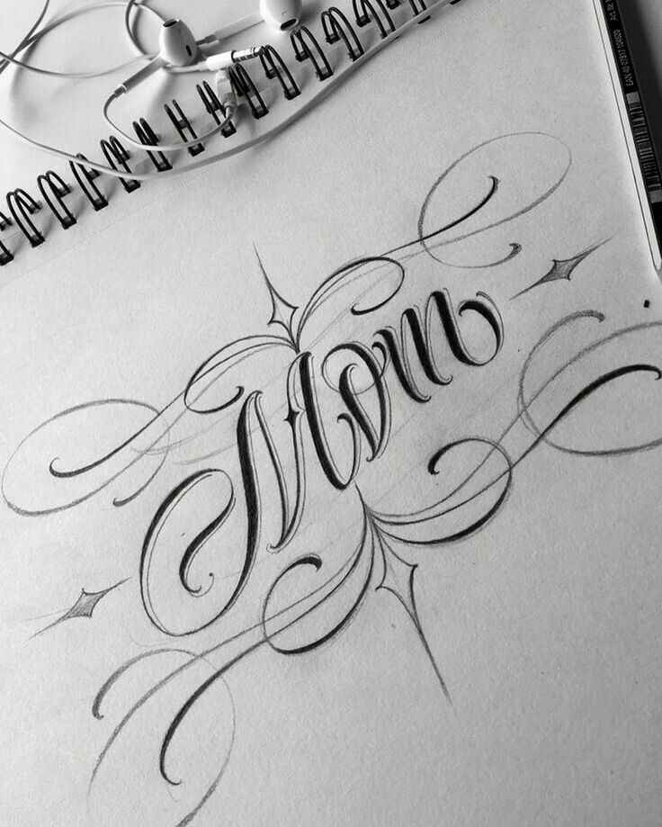 the word mom written in cursive writing on paper