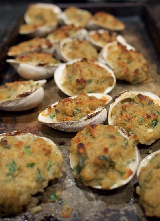 an assortment of baked food items on a baking sheet