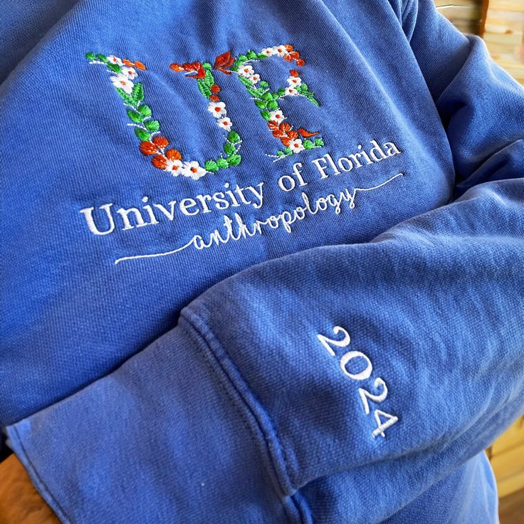 Custom College Floral Embroidered Sweatshirt, Floral Letter Embroidered Hoodie, College Hoodie Sweatshirt, High School Shirt, Graduation Gift ----------------------------- 🎁Introducing our Custom College Floral Embroidered Sweatshirt, the perfect way to showcase your college pride in style. Our Floral Letter Embroidered Hoodie is made with premium-quality materials and features custom embroidery that showcases your school's floral emblem. Whether you're looking for a comfortable college crew or a stylish high school hoodie, this sweatshirt is the perfect choice. It also makes a great graduation gift for any student. With our Custom College Floral Embroidered Sweatshirt, you'll be able to show off your school spirit in a unique and eye-catching way. 1️⃣Available colors: 👉 Brand: Comfort C University Hoodies, Hoodies Aesthetic, College Gear, Pet People, Great Graduation Gifts, Outline Designs, College Hoodies, Floral Letters, Embroidered Sweatshirt