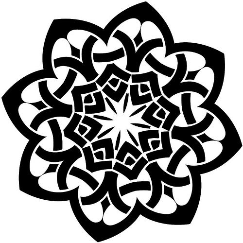 a black and white circular design with an intricate flower in the center, on a white background