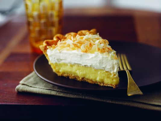 a piece of pie sitting on top of a black plate