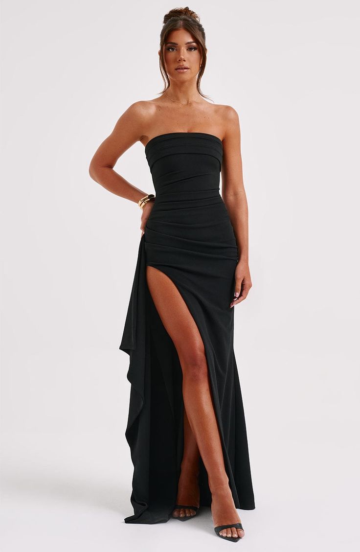 Feel like a siren in Zafira, our timeless maxi made in luxury double stretch crepe that moulds to your body for a heavenly fit. With a strapless neckline and ruched detailing, this showstopping look has a thigh high split and drape ruffle to one side. Colour: Black. Luxury double stretch crepe. Strapless. Ruched detailing. Moulds to body figure. Thigh high split. Drape ruffle detail. Maxi length. Model is an XS and is wearing an XS. Black Tie Maxi Dress, Split Long Dress, Satin Style, 파티 드레스, Boat Neck Dress, Tube Top Dress, Pleated Maxi Dress, Pleated Maxi, Long Summer Dresses