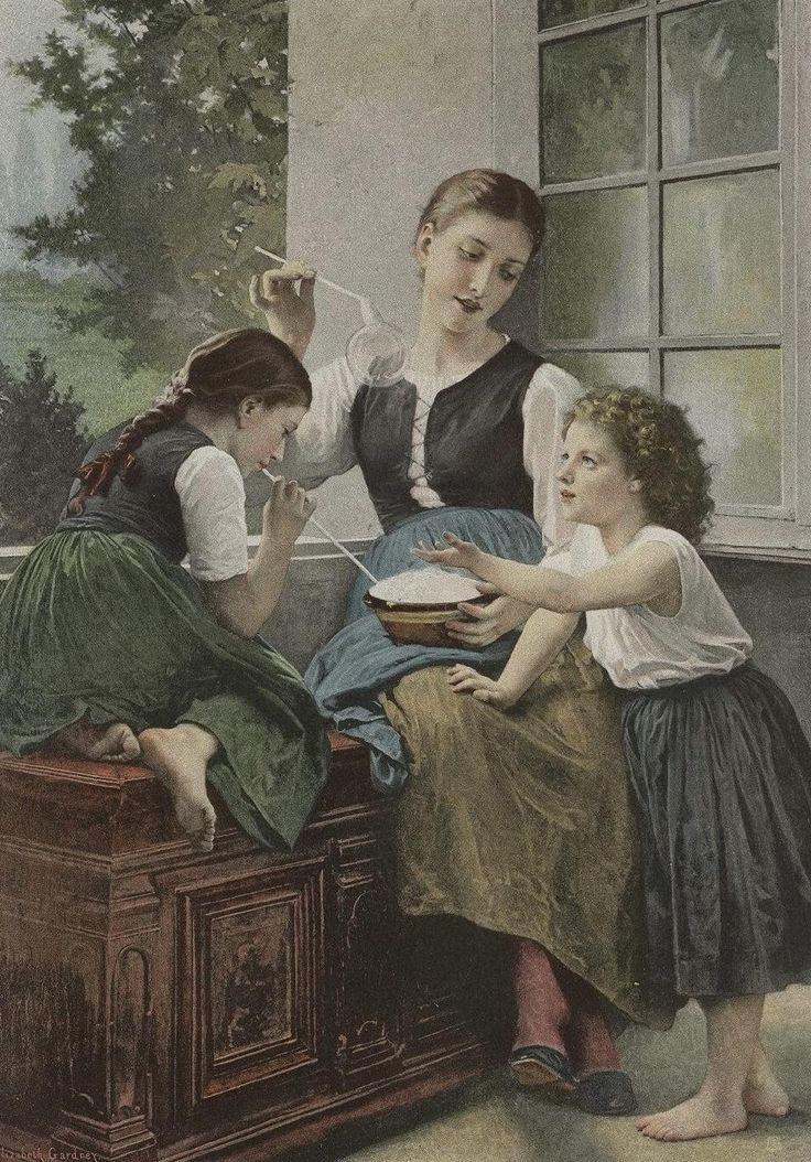 two women and a child are sitting on a bench in front of an open window