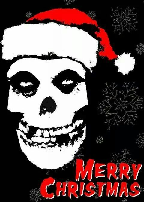 a skull wearing a santa hat with snowflakes on it's head and the words merry christmas written in red