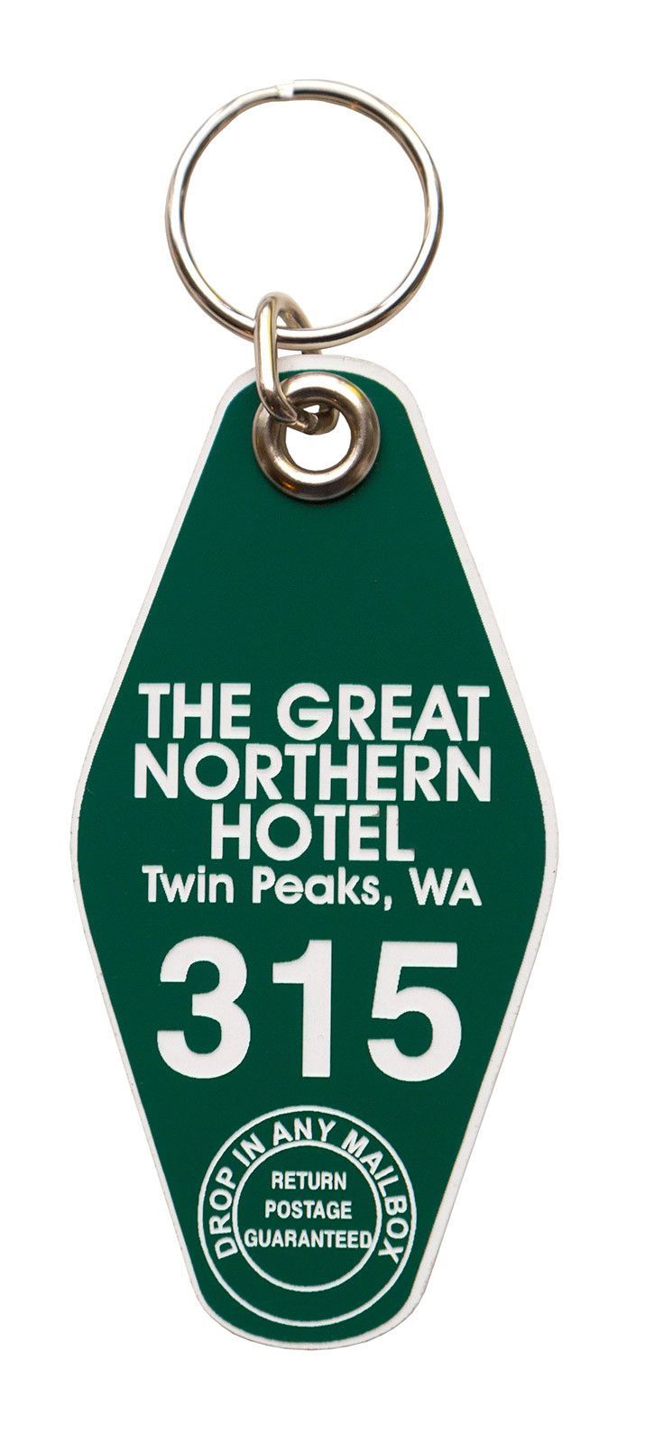 the great northern hotel keychain is green with white lettering and an oval metal ring