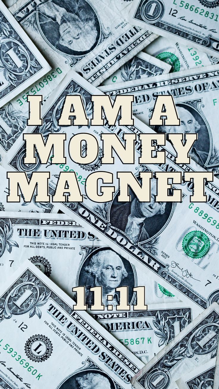 money with the words i am a money magnet on it in front of some hundred dollar bills