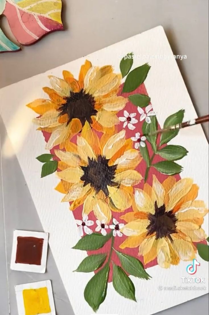 the sunflowers are being painted on canvases