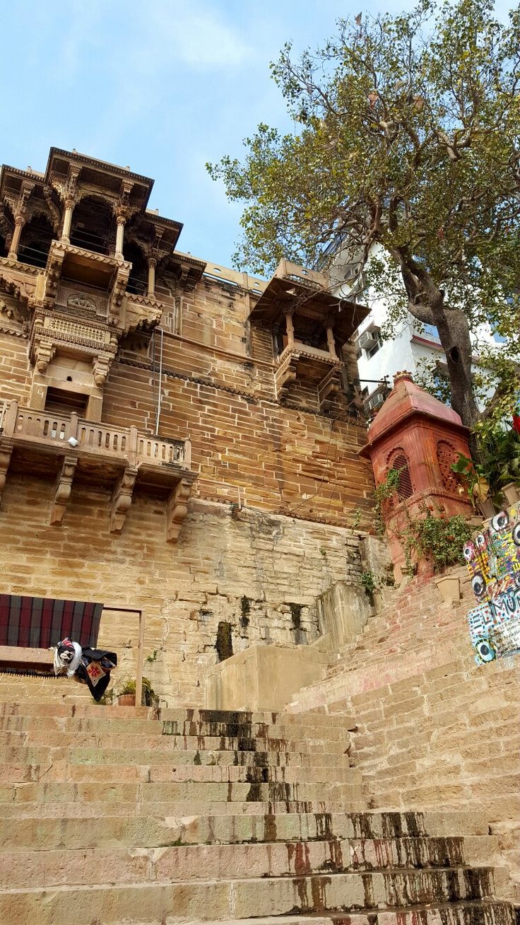 an old building with stairs leading up to it