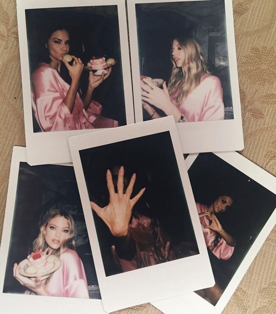 four polaroid photos of two women eating food and one holding her hand up to the camera