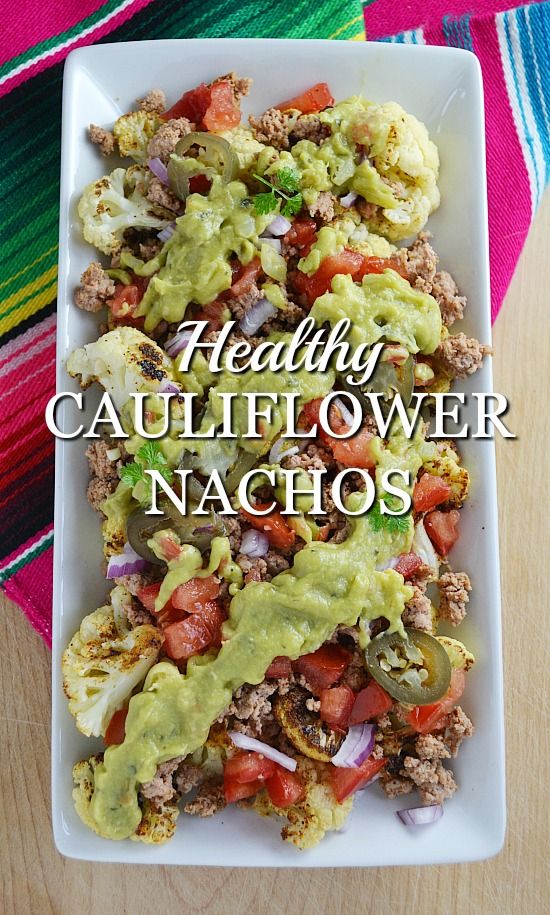 healthy cauliflower nachos with guacamole sauce on the side