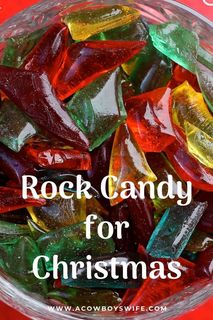 a glass bowl filled with gummy bears and the words rock candy for christmas