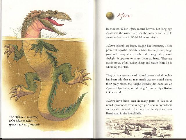 an open book with pictures of dinosaurs