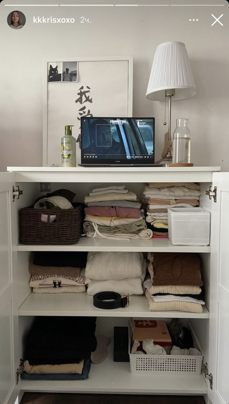 a white closet with lots of items on top of it