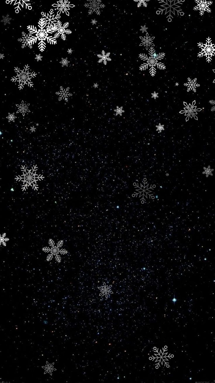 snow flakes are falling down in the night sky