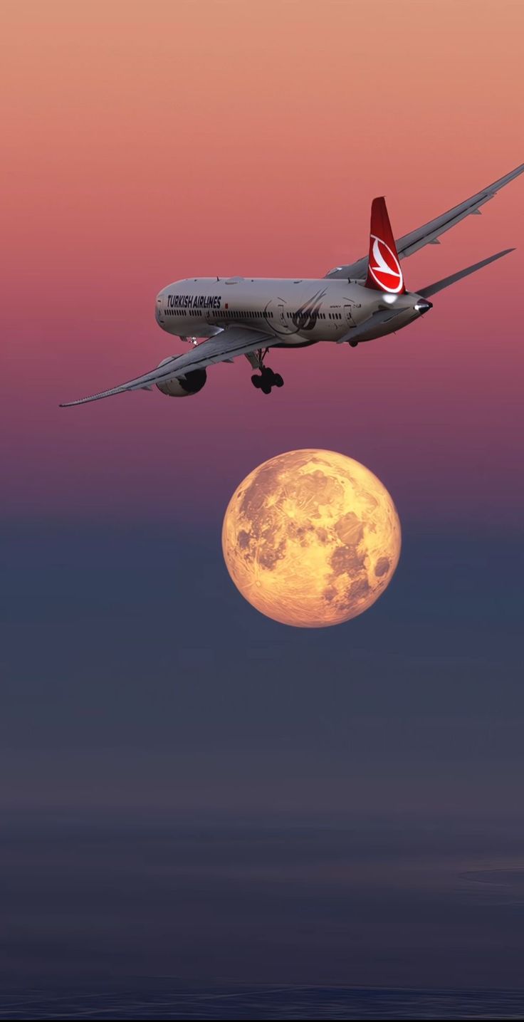 an airplane is flying over the moon in the sky with it's landing gear down