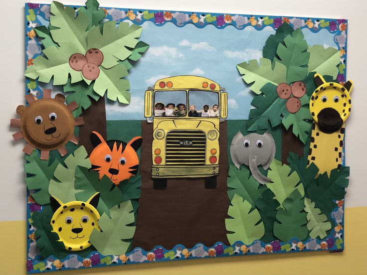 a bulletin board with animals and a bus