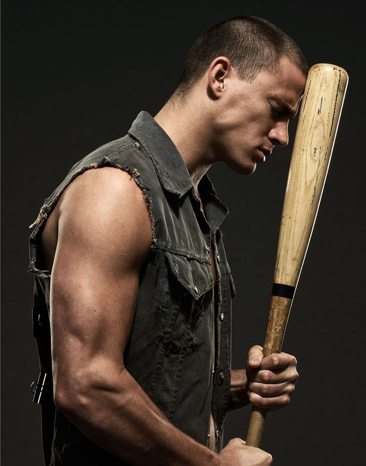 a man holding a baseball bat in his hand