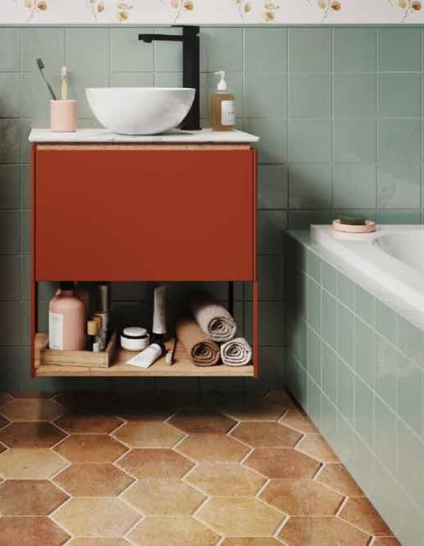 a bathroom with a sink, bathtub and toiletries on the shelf next to it