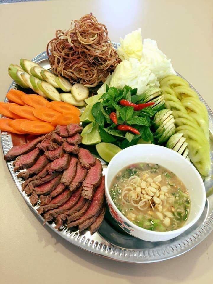 a platter with meat, vegetables and noodles on it is shown in this image