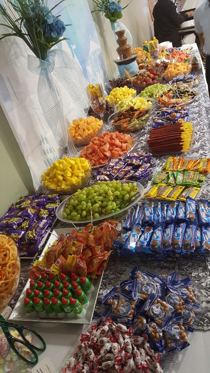 a buffet table filled with lots of different types of candy and candies on it